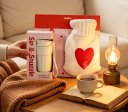 With plush hot water bottle and portable insulated cup (1)